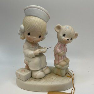 Precious Moments Love Beareth all things